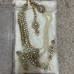 Stone and pearls gold necklace set with tikka and earrings